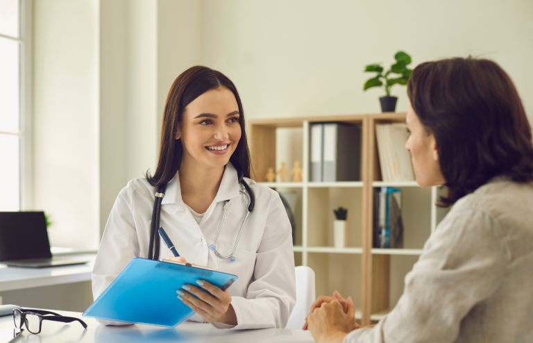Healthcare provider discussing treatment and insurance options for GLP-1 pills with a patient during a consultation.