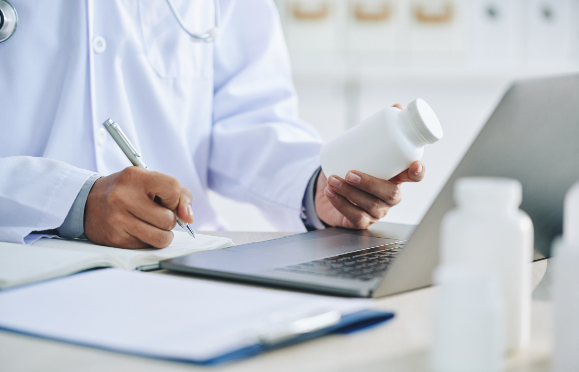 Healthcare provider reviewing prescription medication and coverage details for GLP-1 pills under Medicaid