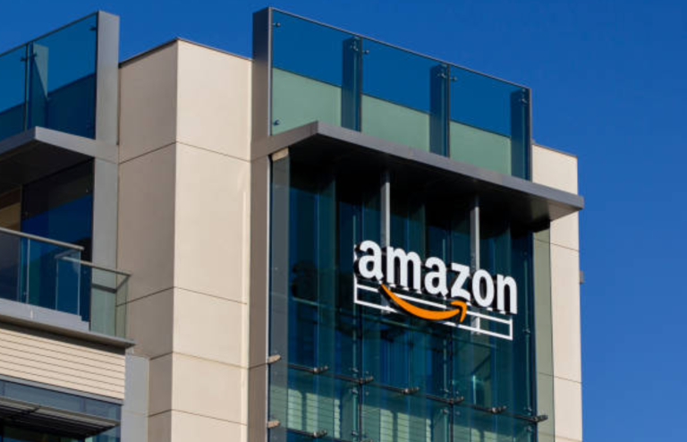 Amazon logo displayed on a modern office building exterior