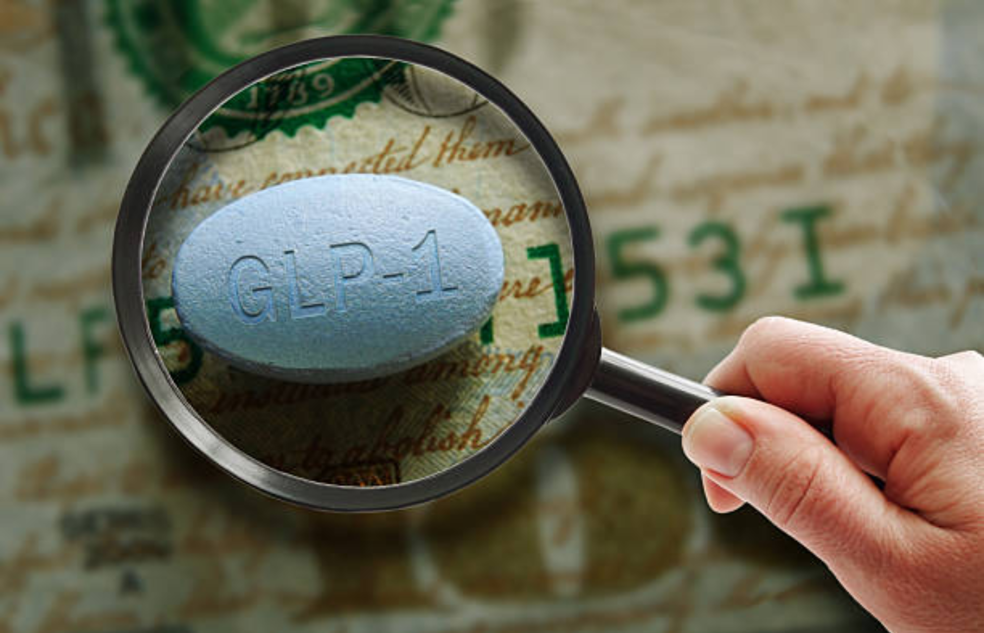 Blue GLP-1 pill viewed through a magnifying glass