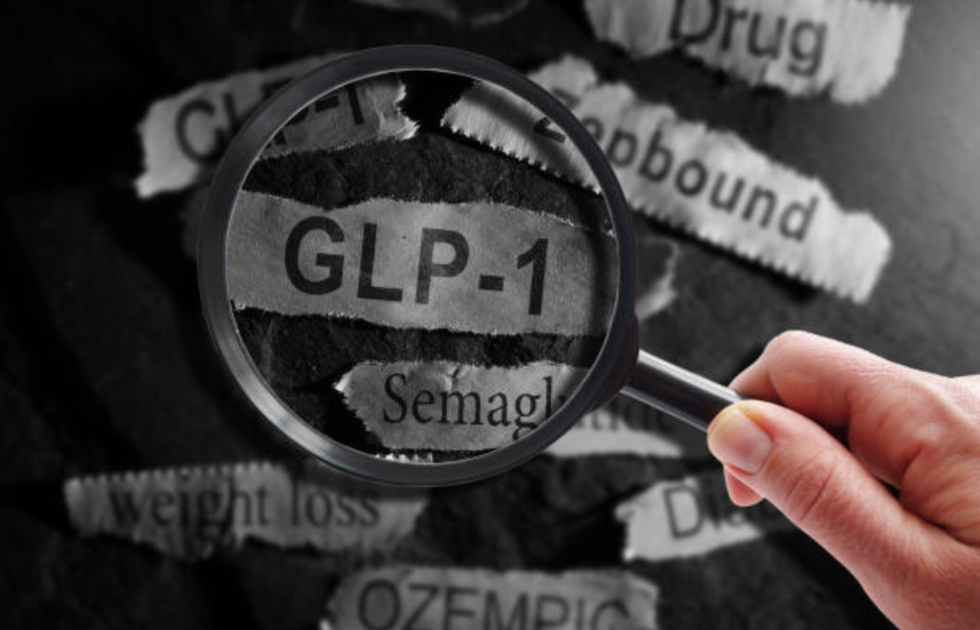 Magnifying glass highlighting the term “GLP-1” among words related to obesity drugs and weight loss treatments.