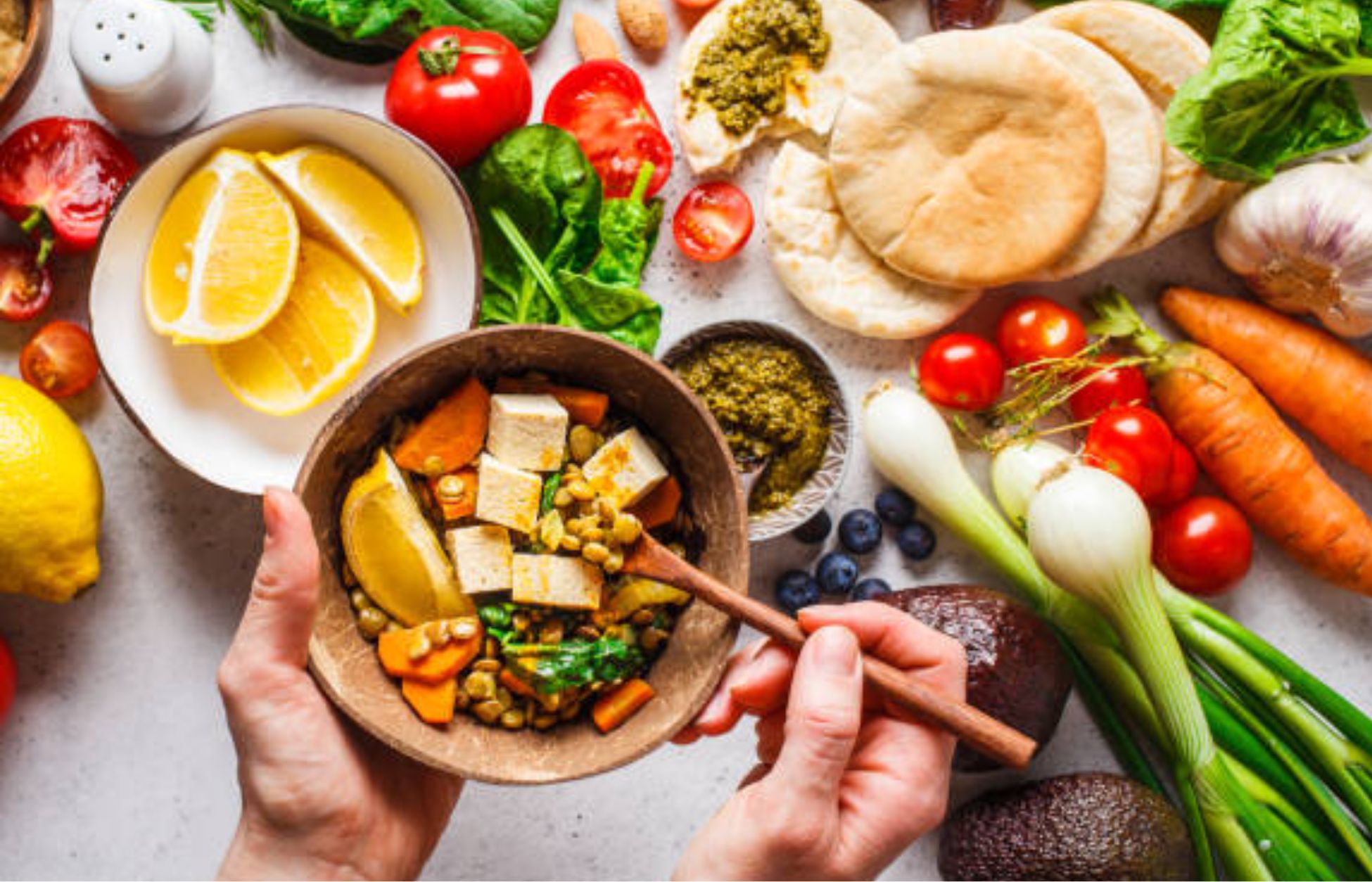 Healthy meal with vegetables, tofu, and fresh produce supporting muscle maintenance on GLP-1 therapy.