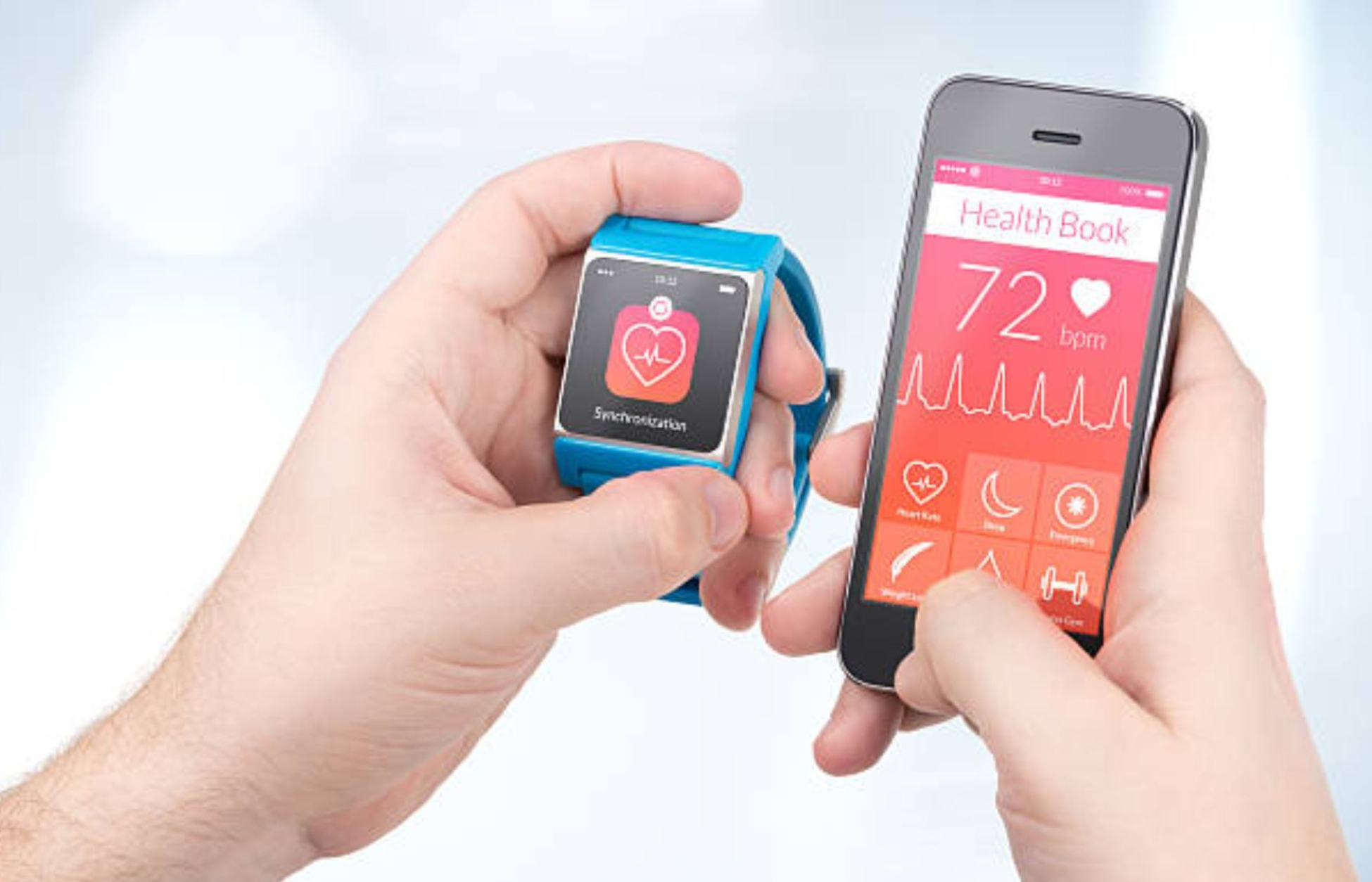 Person holding a smartwatch and smartphone displaying heart rate and health tracking data.