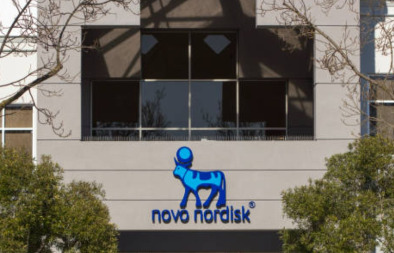 Novo Nordisk logo displayed on the exterior of a corporate office building.
