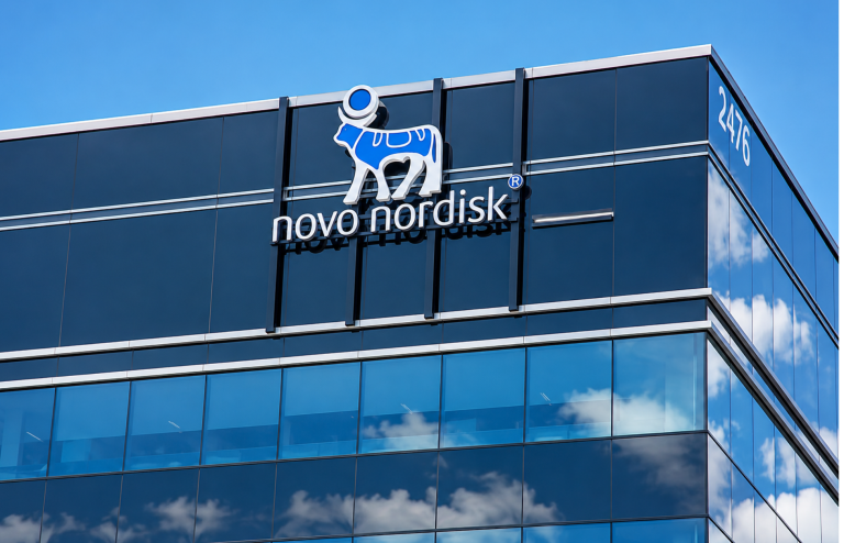 Novo Nordisk logo displayed on a modern glass office building.