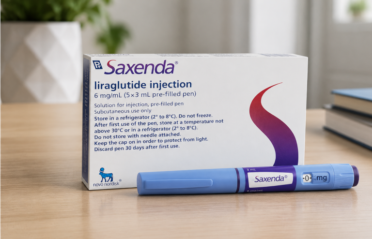 Saxenda (liraglutide) injection box and pre-filled pen displayed on a wooden table in a realistic clinical setting.