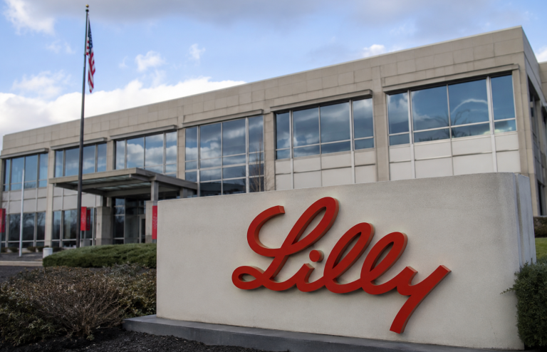 Eli Lilly corporate headquarters building with its red logo sign.